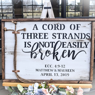 white washed unity ceremony sign for wedding on an easel